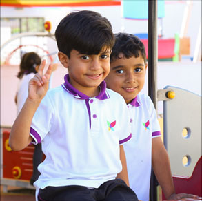 Young boy giving peace sign